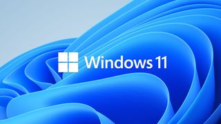 Varsayılan duvar kağıdının önünde Windows 11 logosu